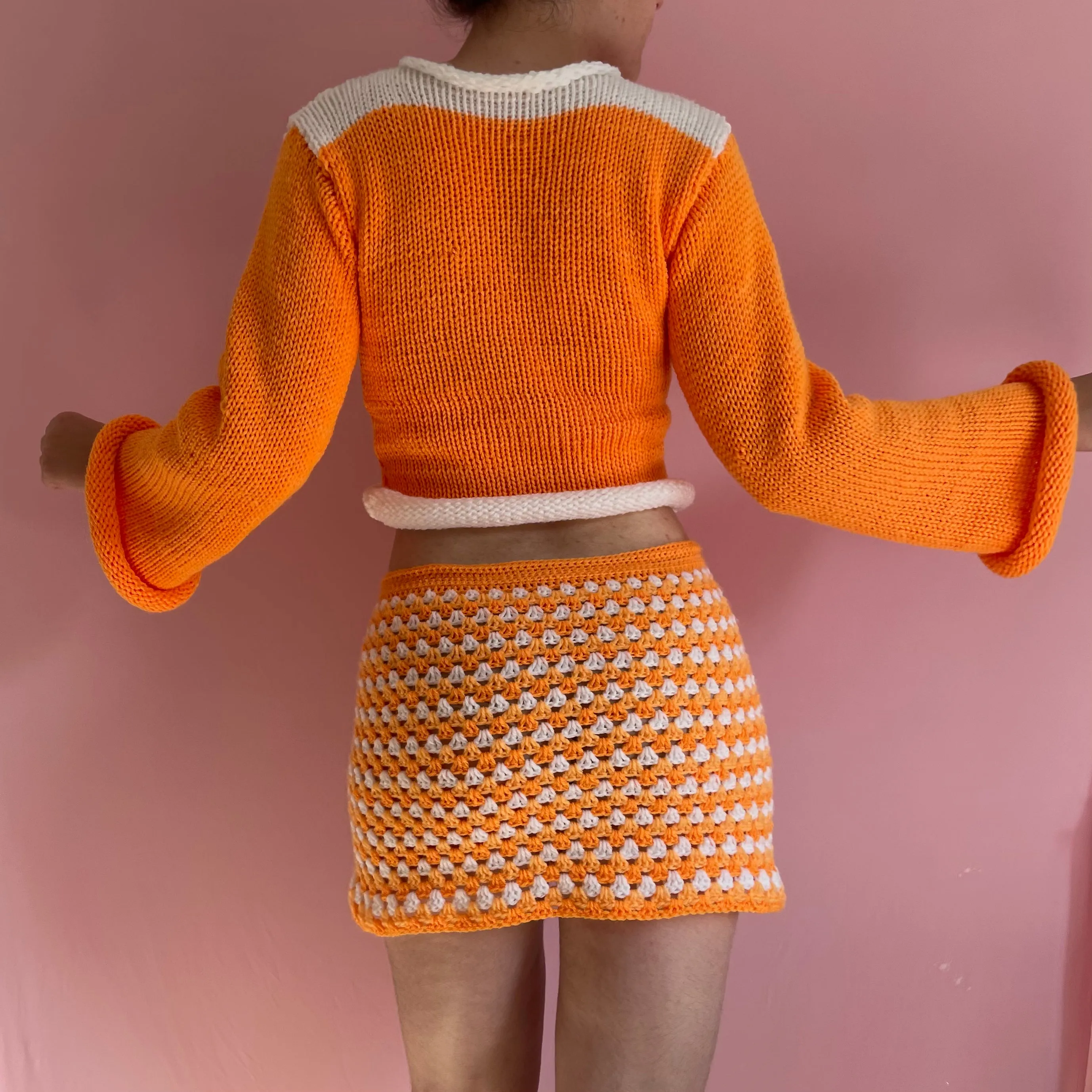 Handmade knitted colour block jumper in orange and white