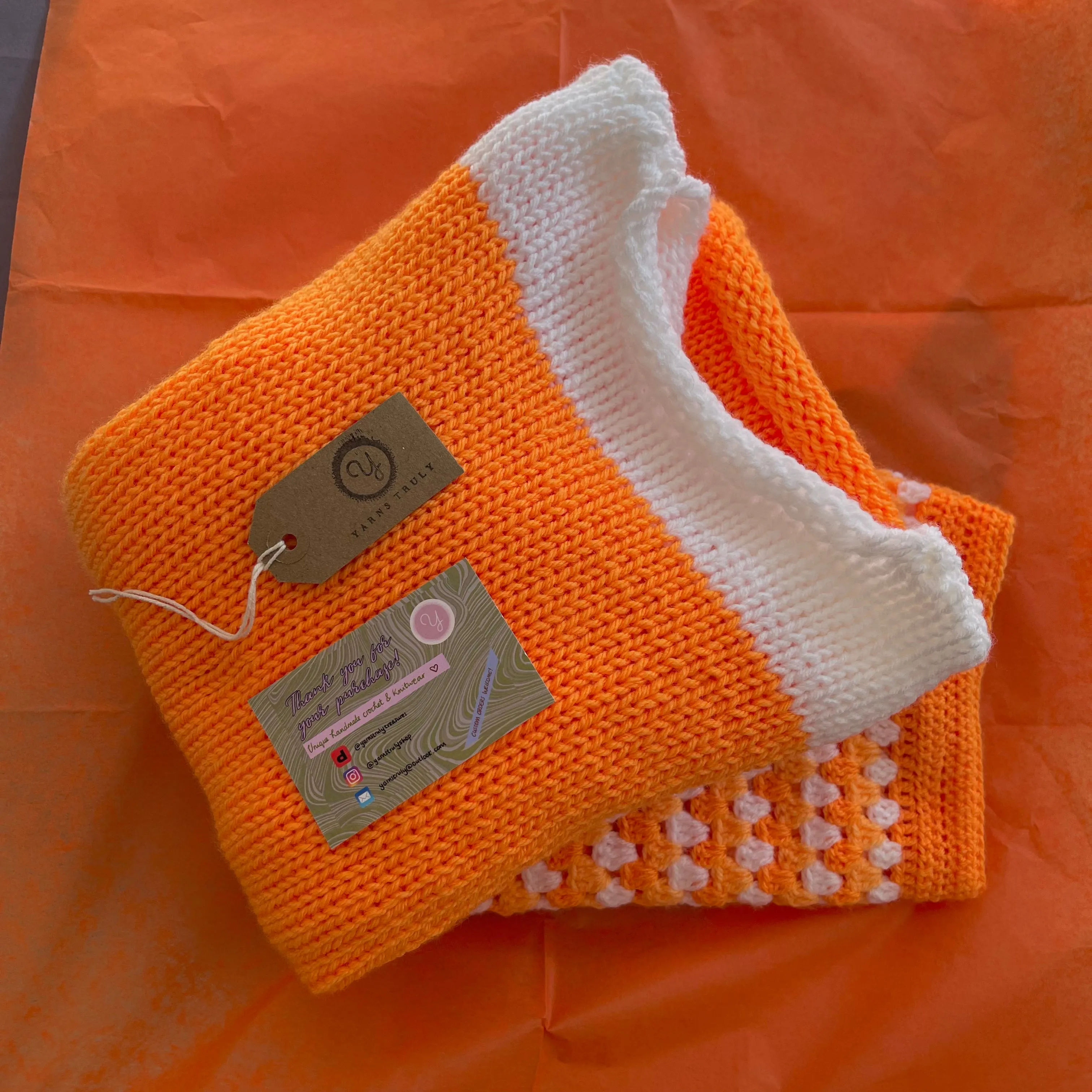 Handmade knitted colour block jumper in orange and white