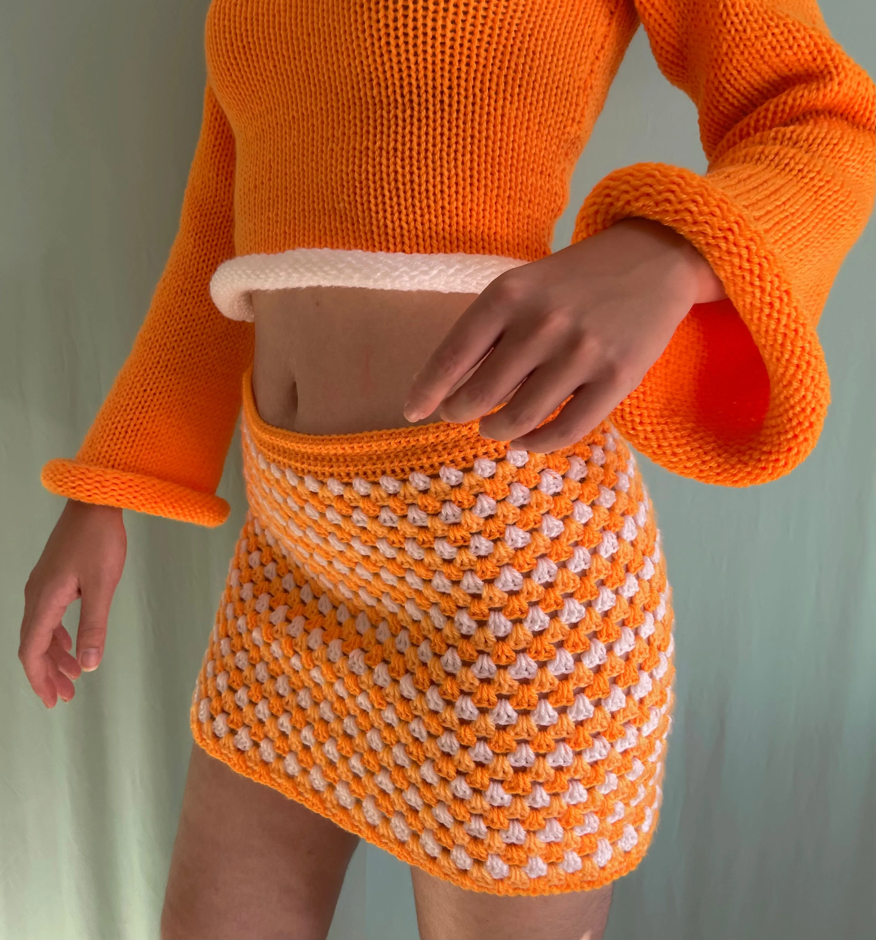 Handmade knitted colour block jumper in orange and white