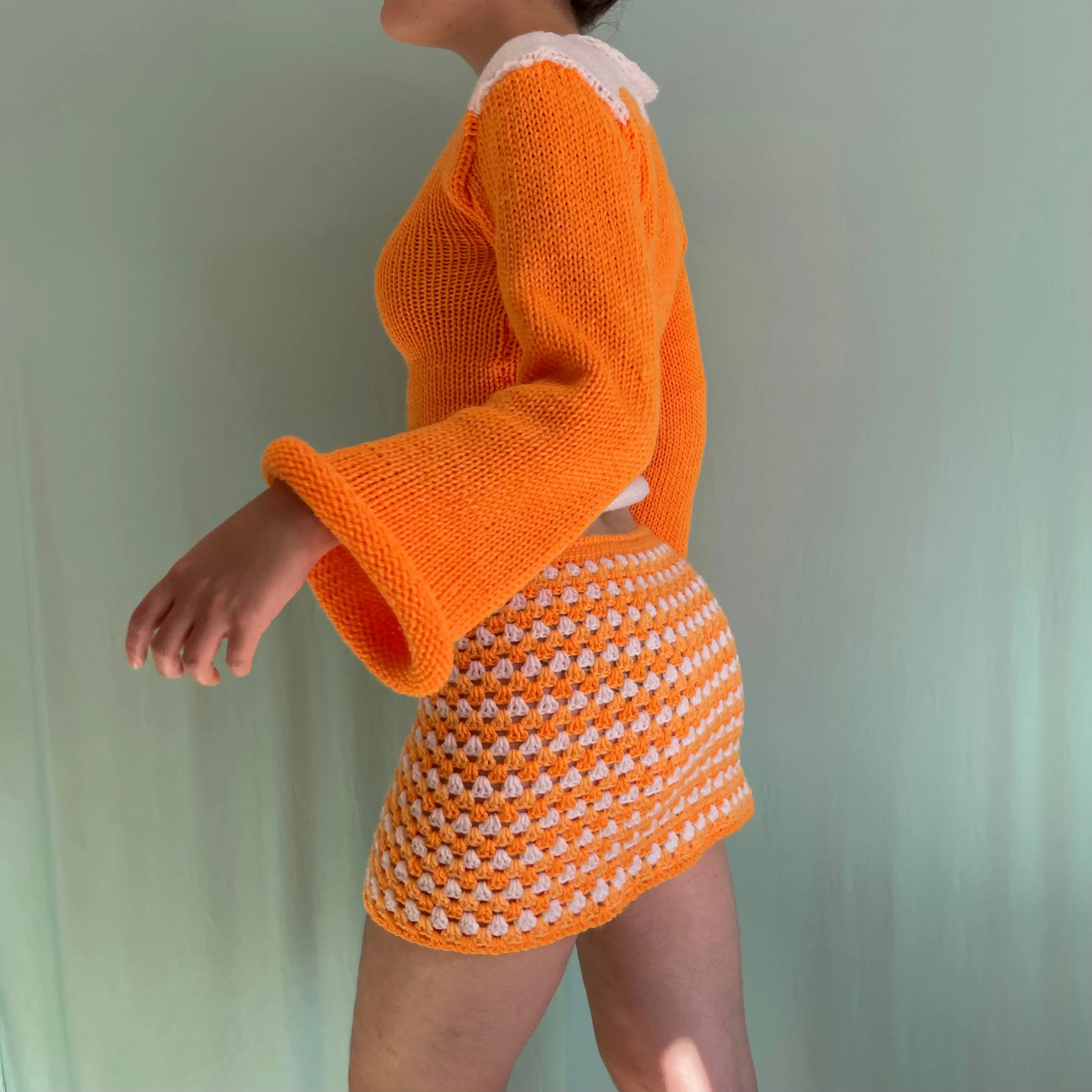 Handmade knitted colour block jumper in orange and white