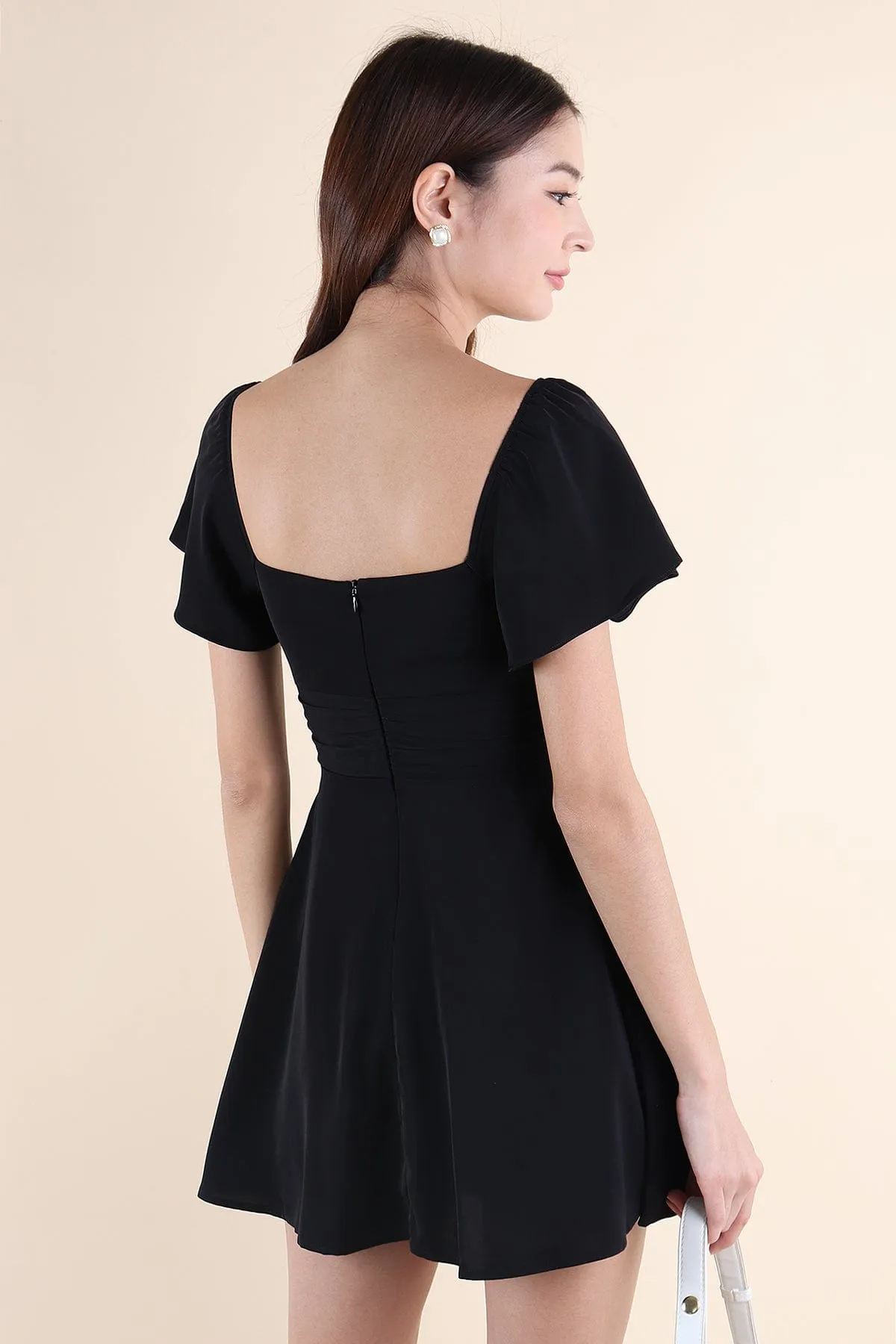 NEVEA RUCHED FLUTTER SLEEVE DRESS IN BLACK