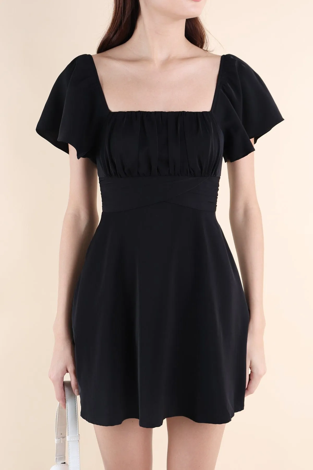 NEVEA RUCHED FLUTTER SLEEVE DRESS IN BLACK