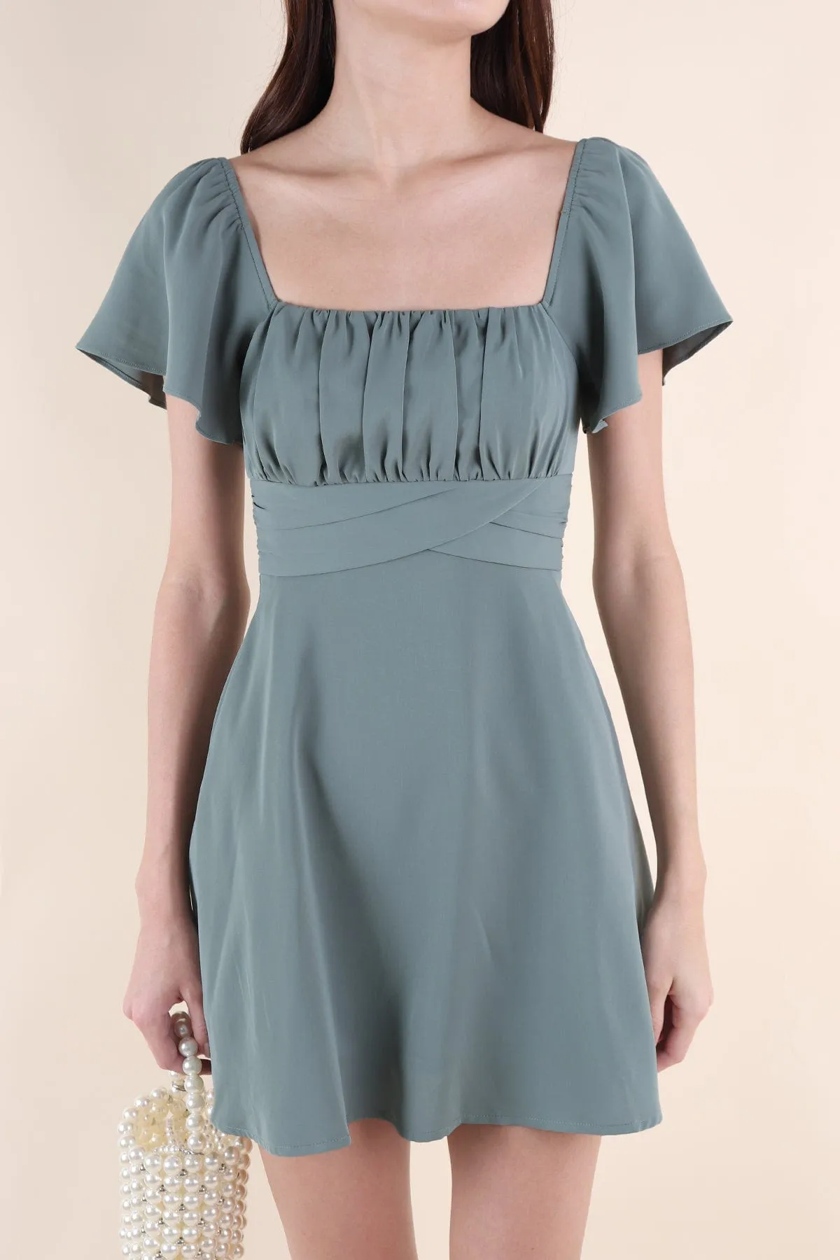 NEVEA RUCHED FLUTTER SLEEVE DRESS IN GREEN