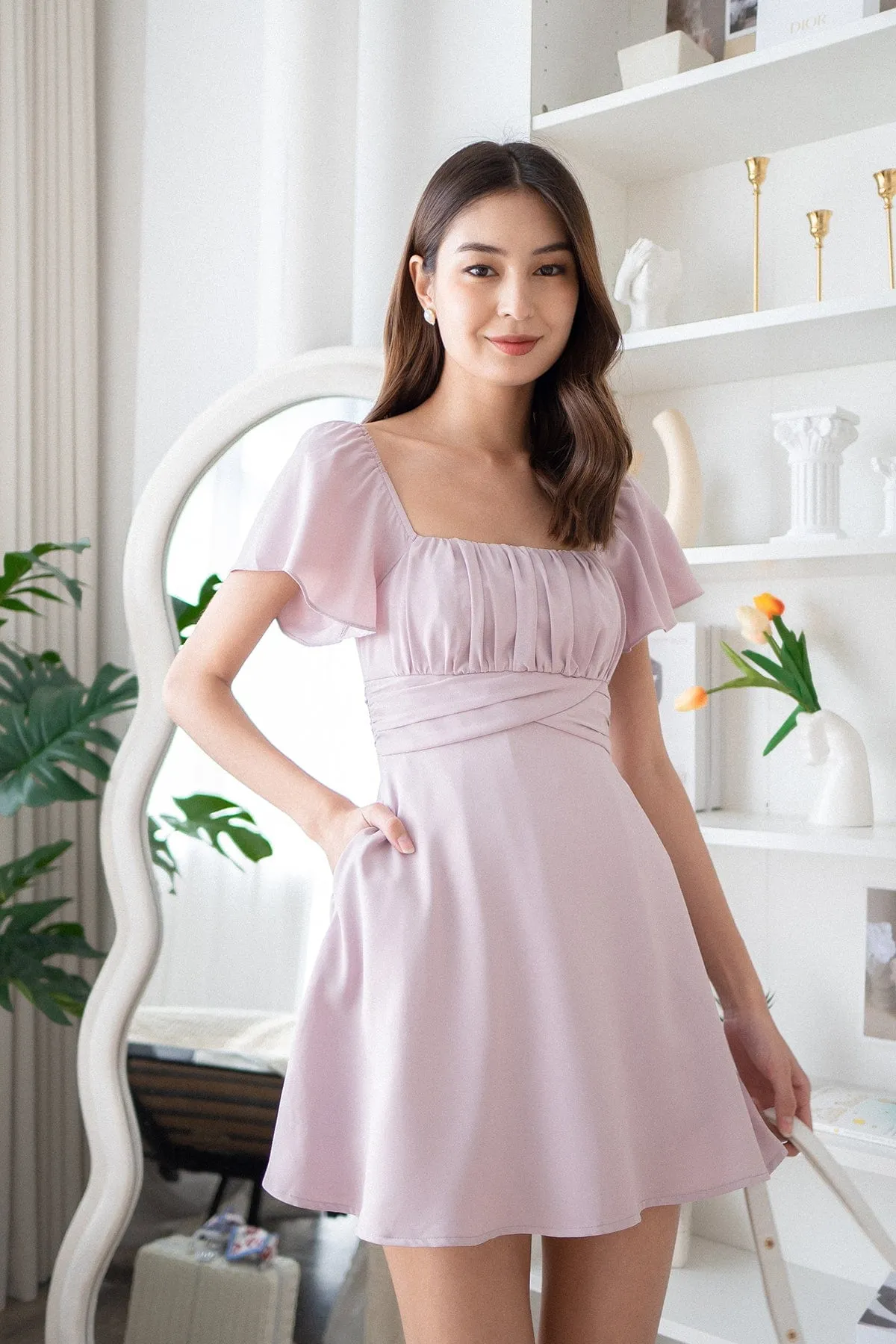 NEVEA RUCHED FLUTTER SLEEVE DRESS IN LILAC PINK