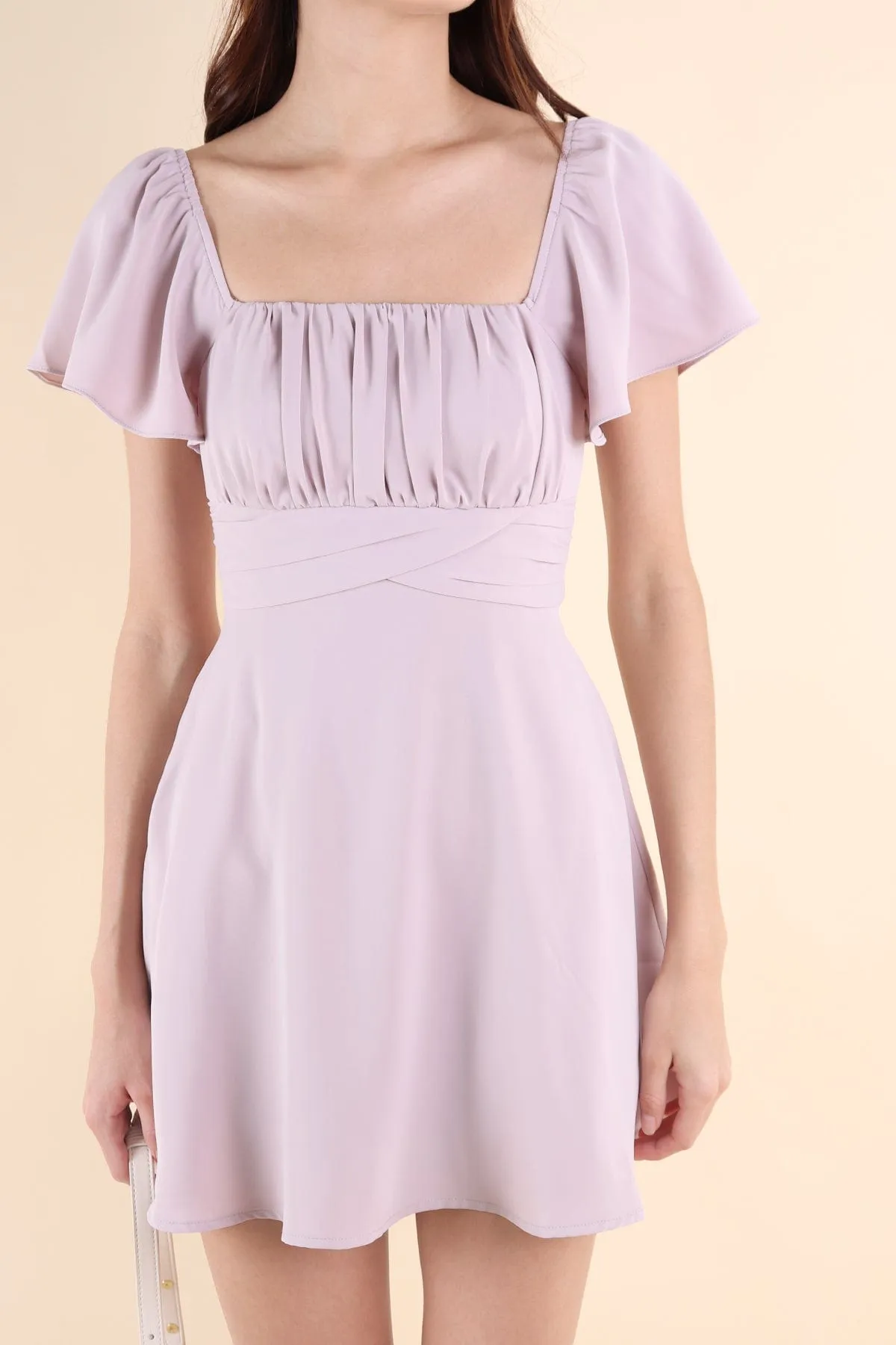 NEVEA RUCHED FLUTTER SLEEVE DRESS IN LILAC PINK