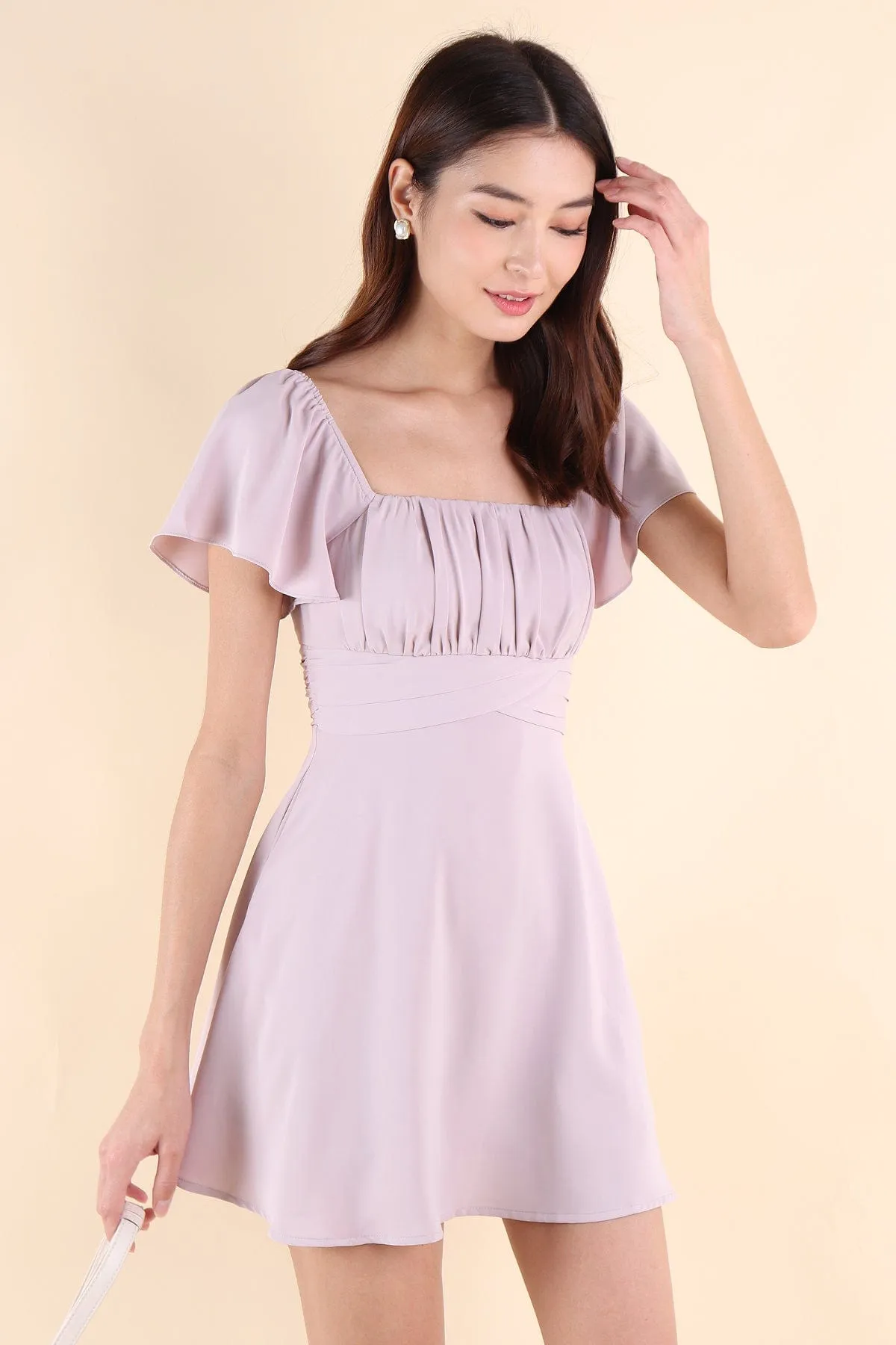 NEVEA RUCHED FLUTTER SLEEVE DRESS IN LILAC PINK