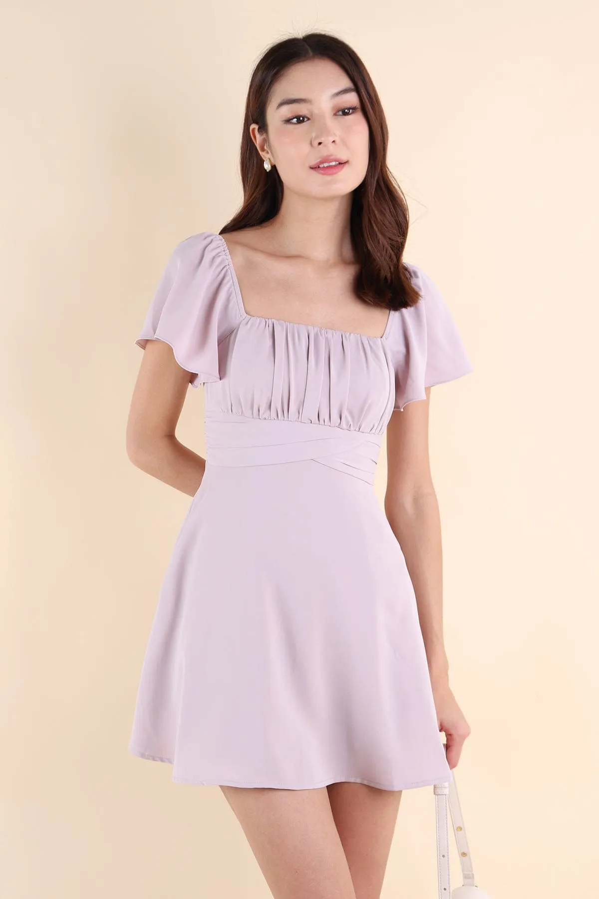 NEVEA RUCHED FLUTTER SLEEVE DRESS IN LILAC PINK